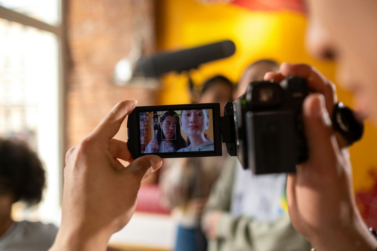 Capturing the filming process with a focus on the camera display indoors.