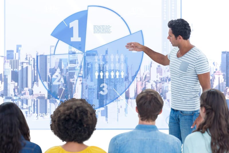 Presenter delivering a live product demo to an engaged audience