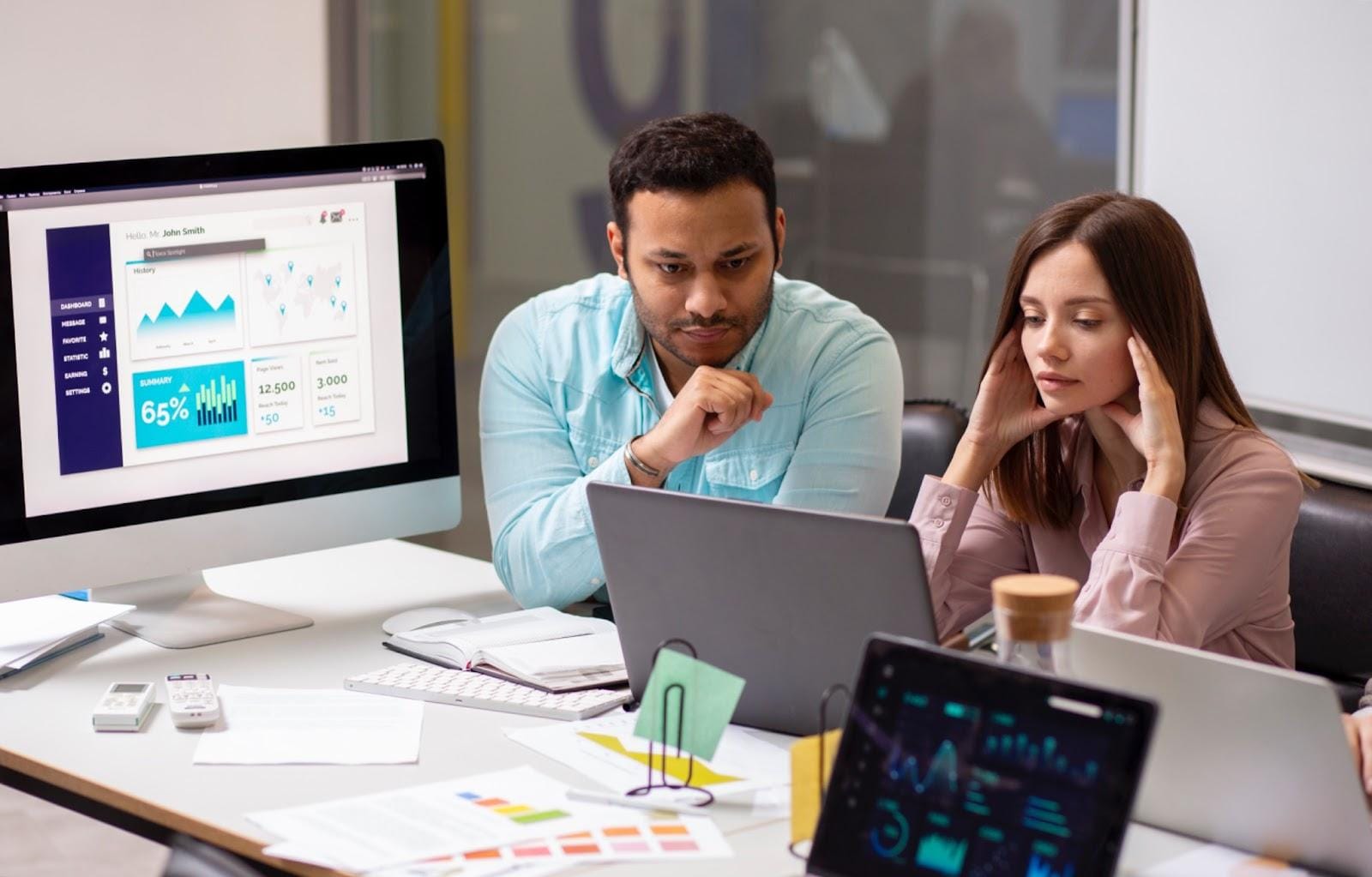  Two people working on sales enablement