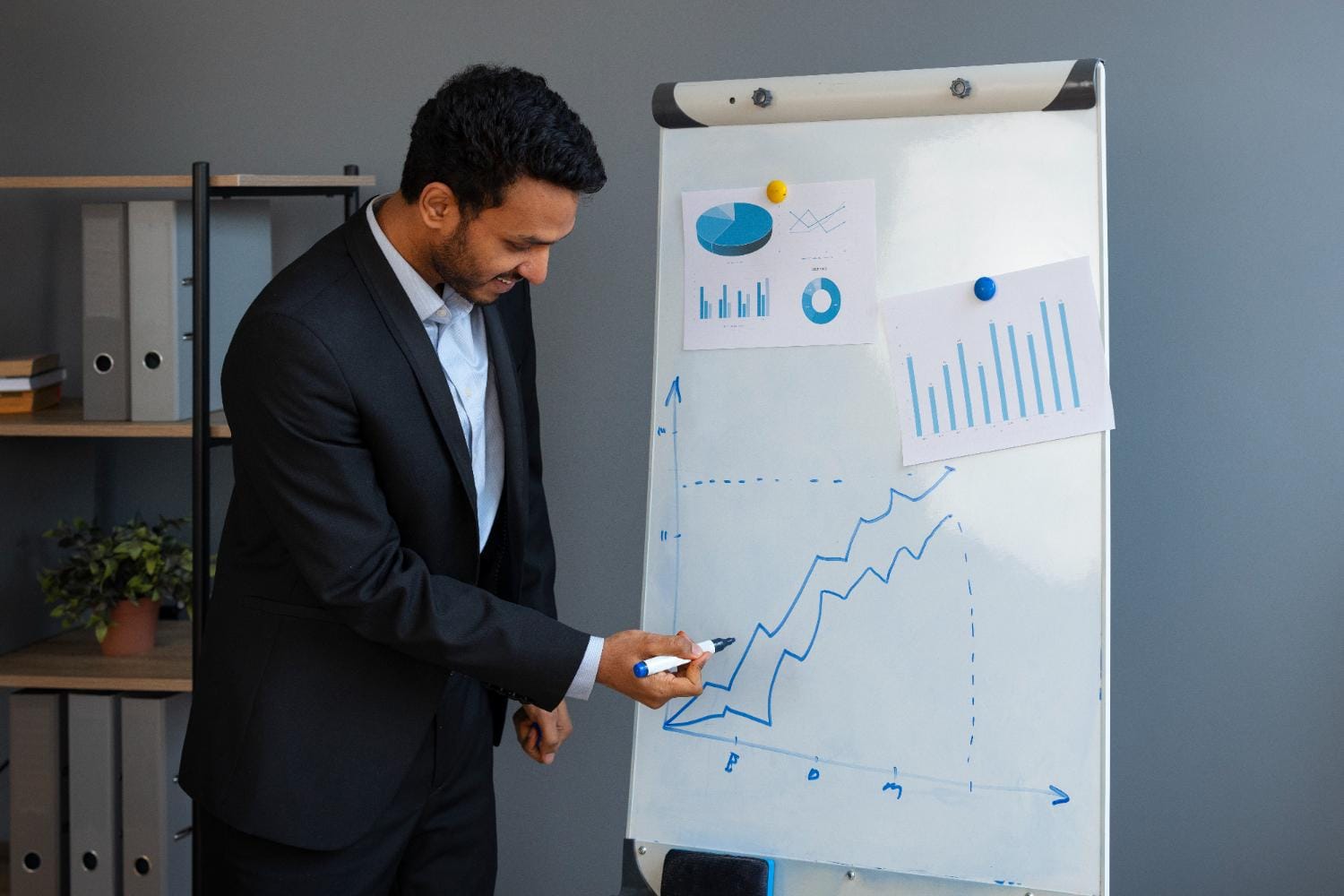 Business person looking at finance graphs