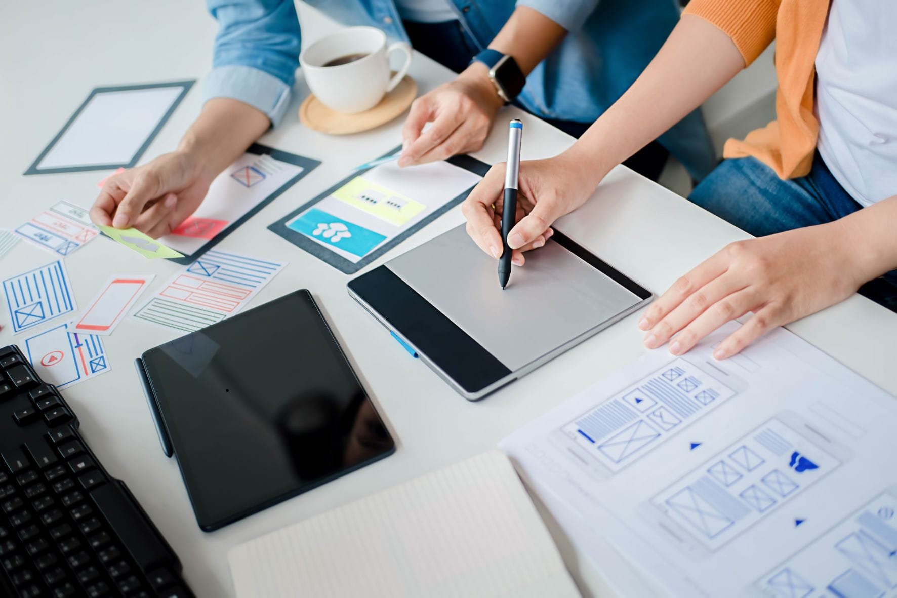 2 people working on design template 