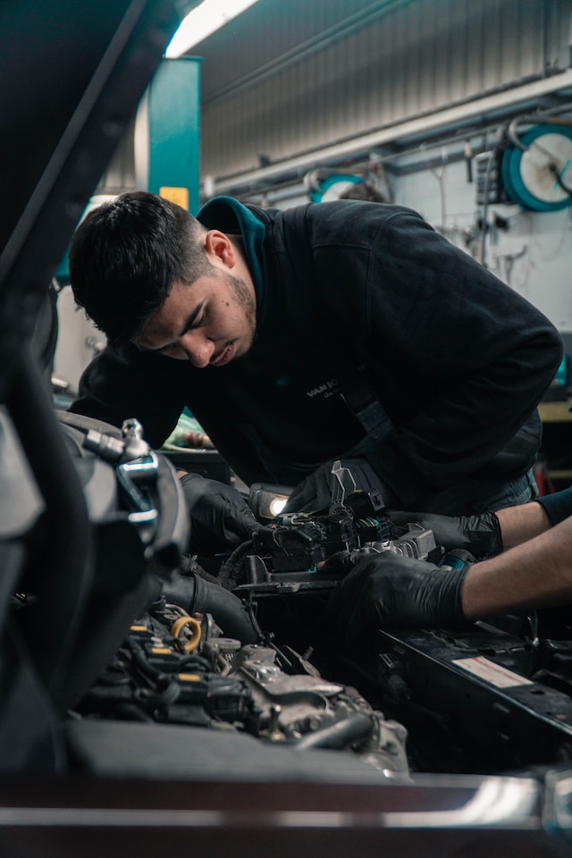 How can auto repair businesses ensure safety and compliance?