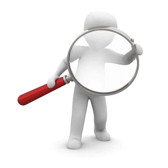 a man with magnifying glass looking for something to find