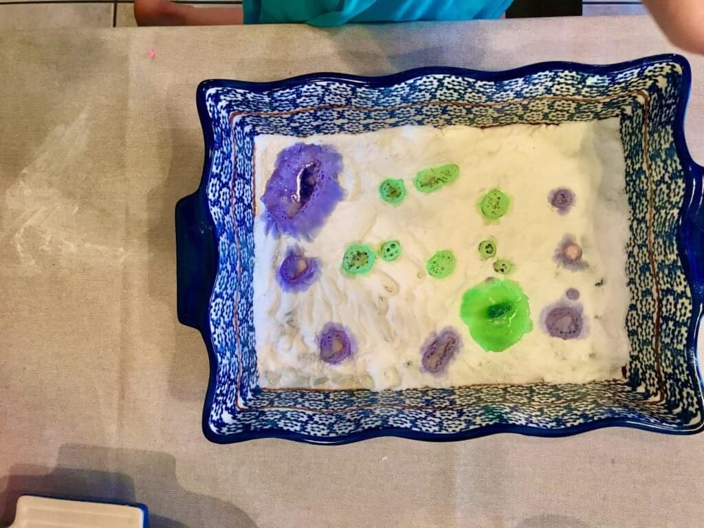 Vibrant artwork created with baking soda and vinegar in a hands-on science experiment for kids