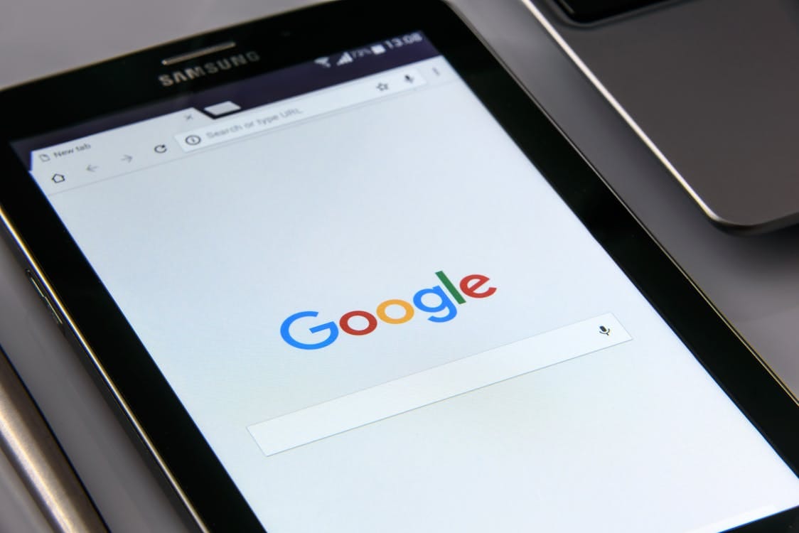 Free Close-up of a tablet displaying Google's search screen, emphasizing technology and internet browsing. Stock Photo