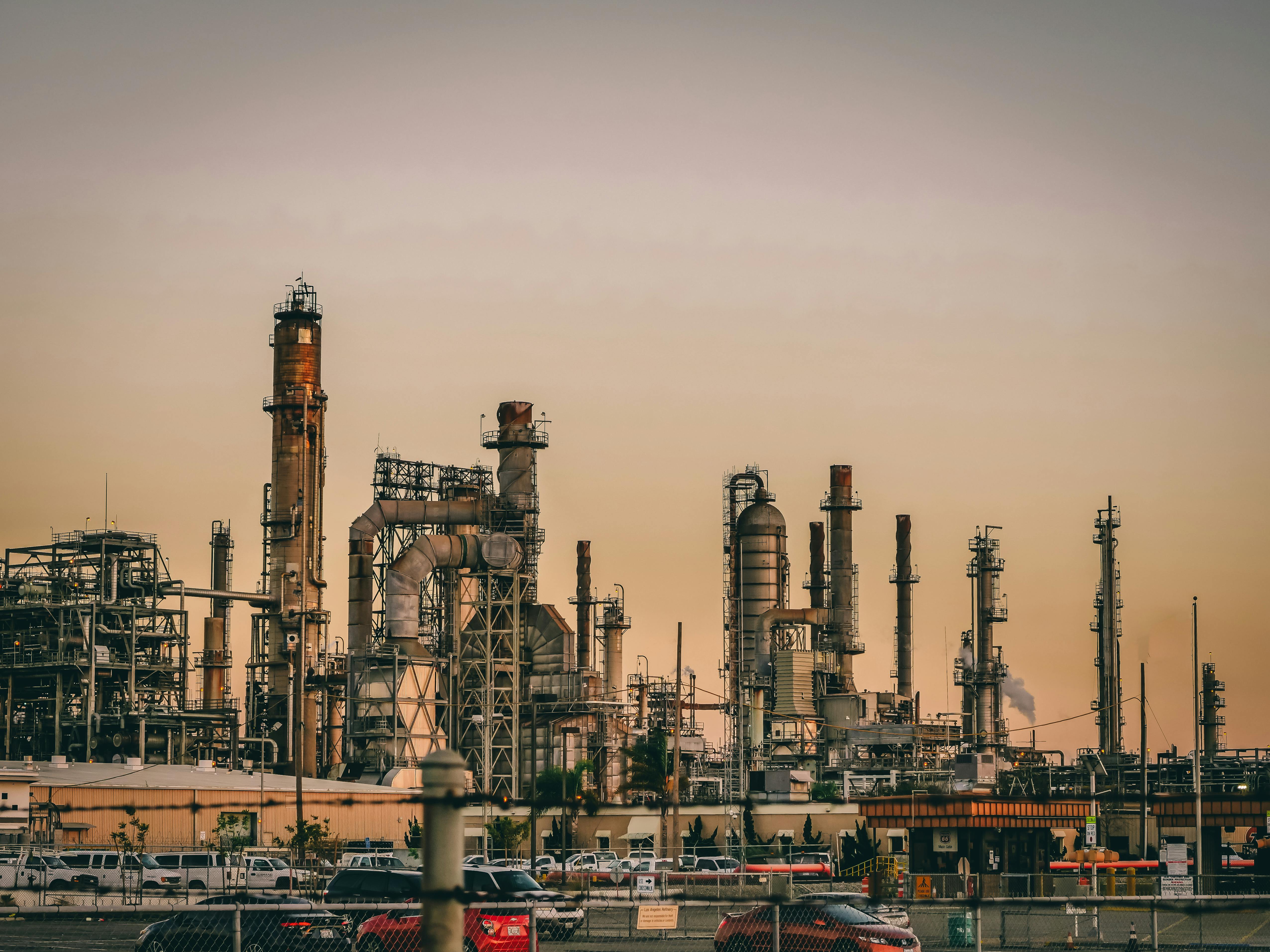 Photo by Pixabay: https://www.pexels.com/photo/photo-of-an-industrial-factory-emitting-smoke-247763/ for a blog on generative ai use cases in manufacturing