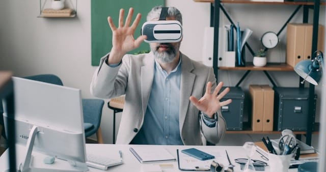 A man wearing a virtual headset in an office