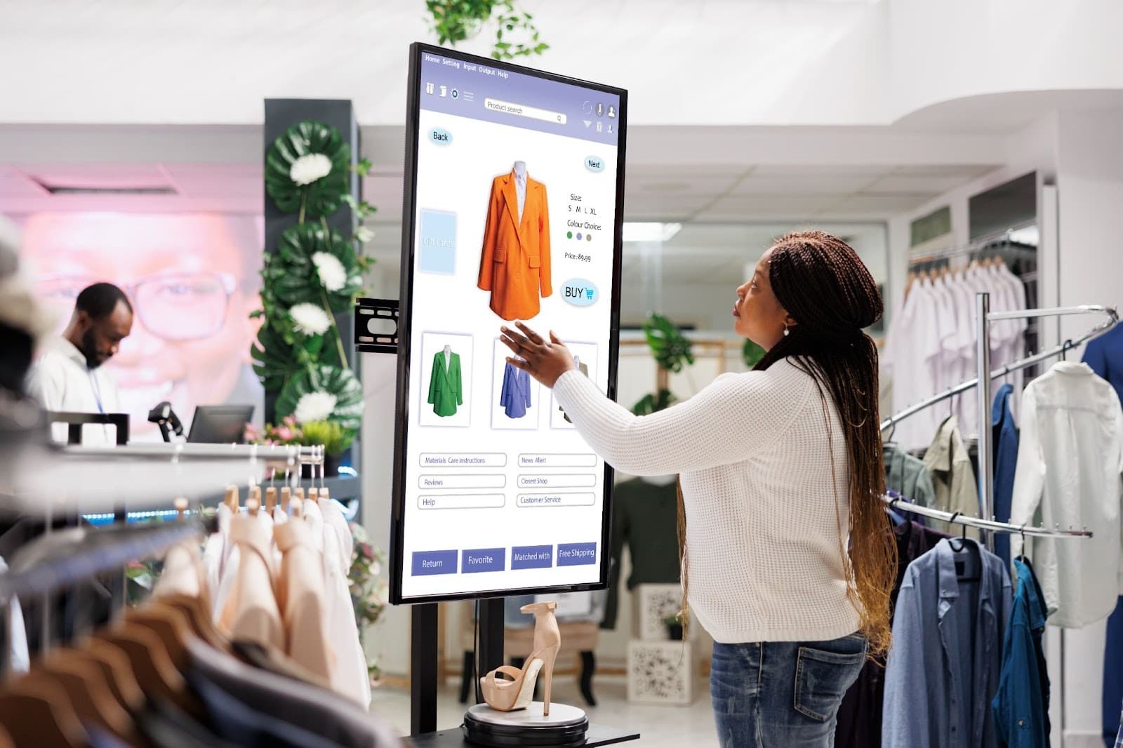 A Woman buyer selecting clothes on screen