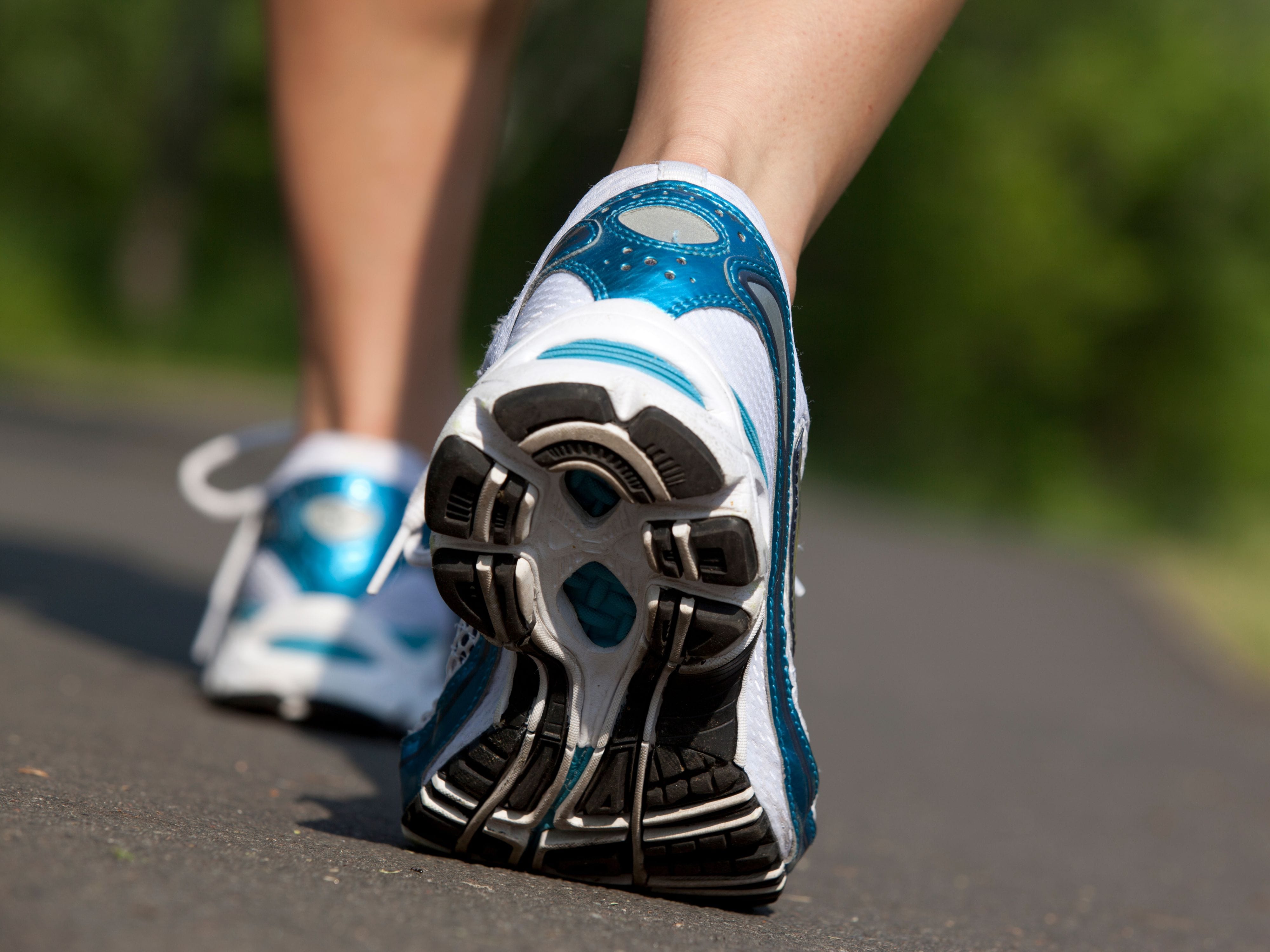 Close-up of a man's shoes while walking