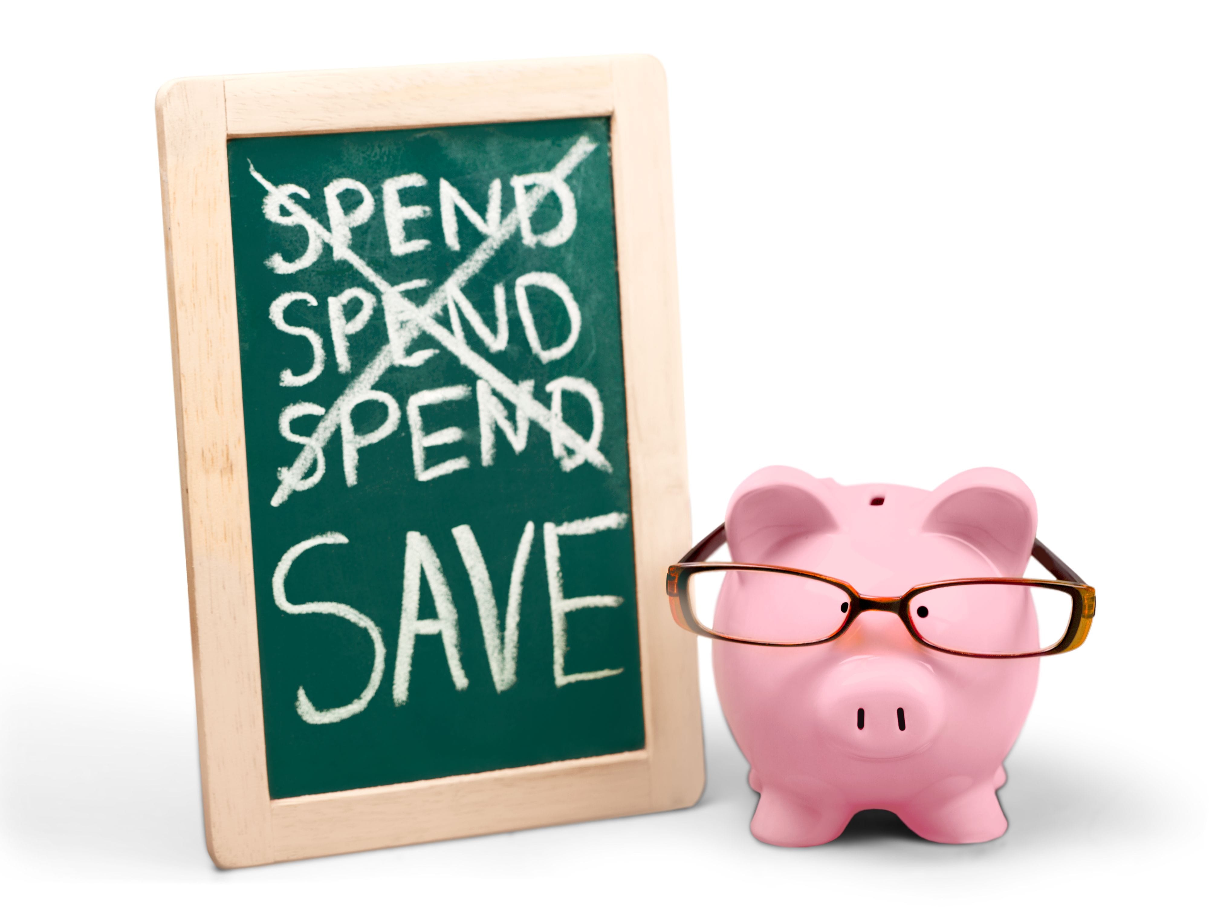 Pig with glasses next to a board showing spending habits