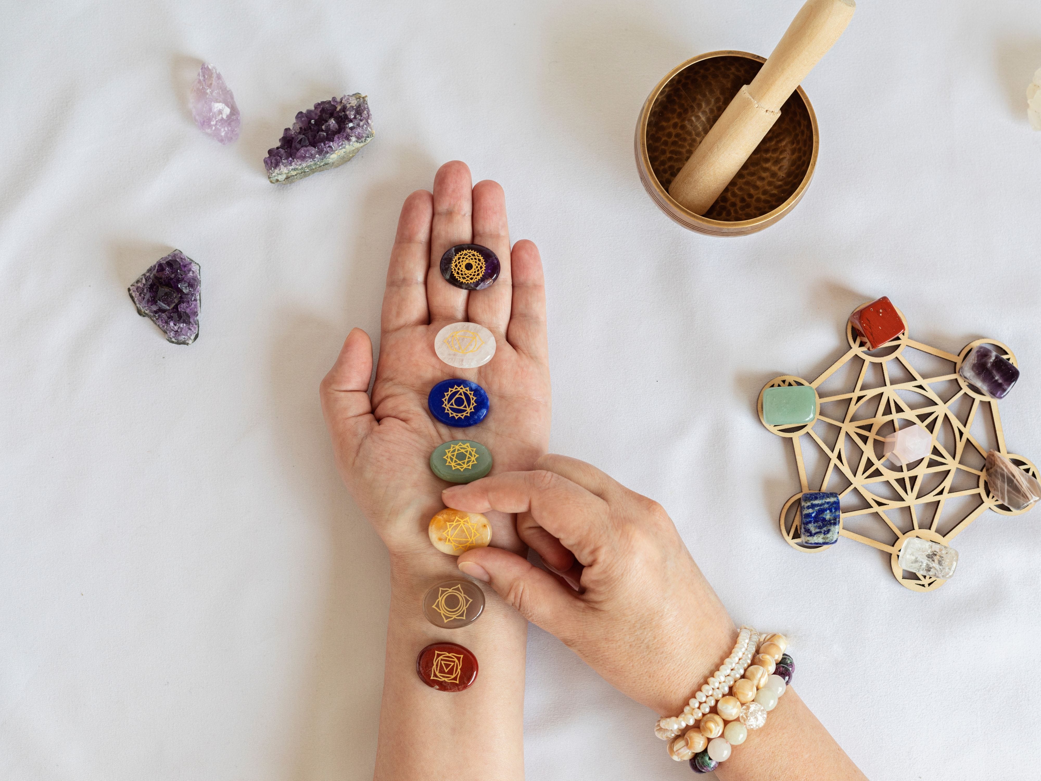 Woman holding Vastu stones with sacred items – Vaastu colors for home