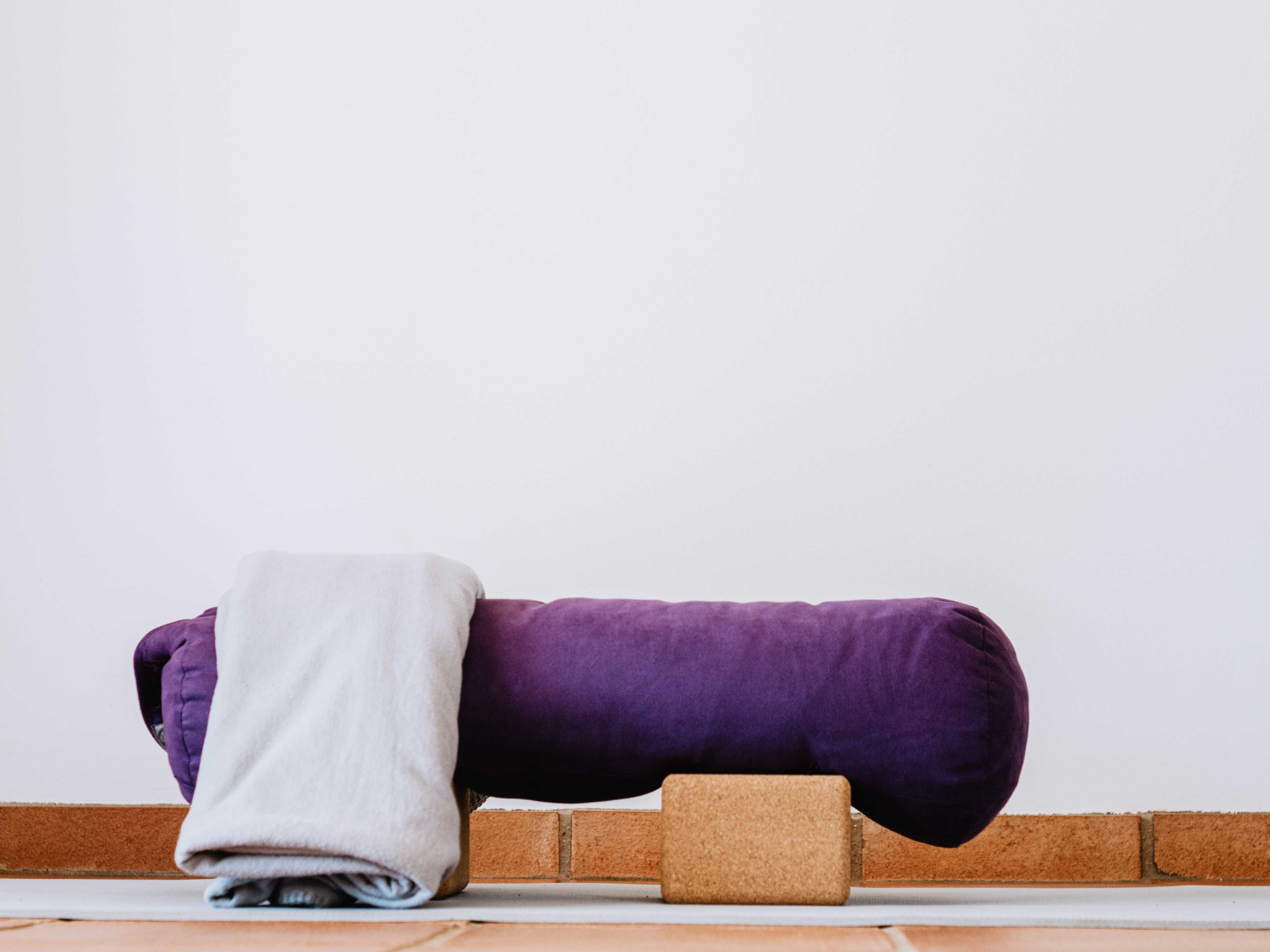 Three yoga blocks placed on the floor