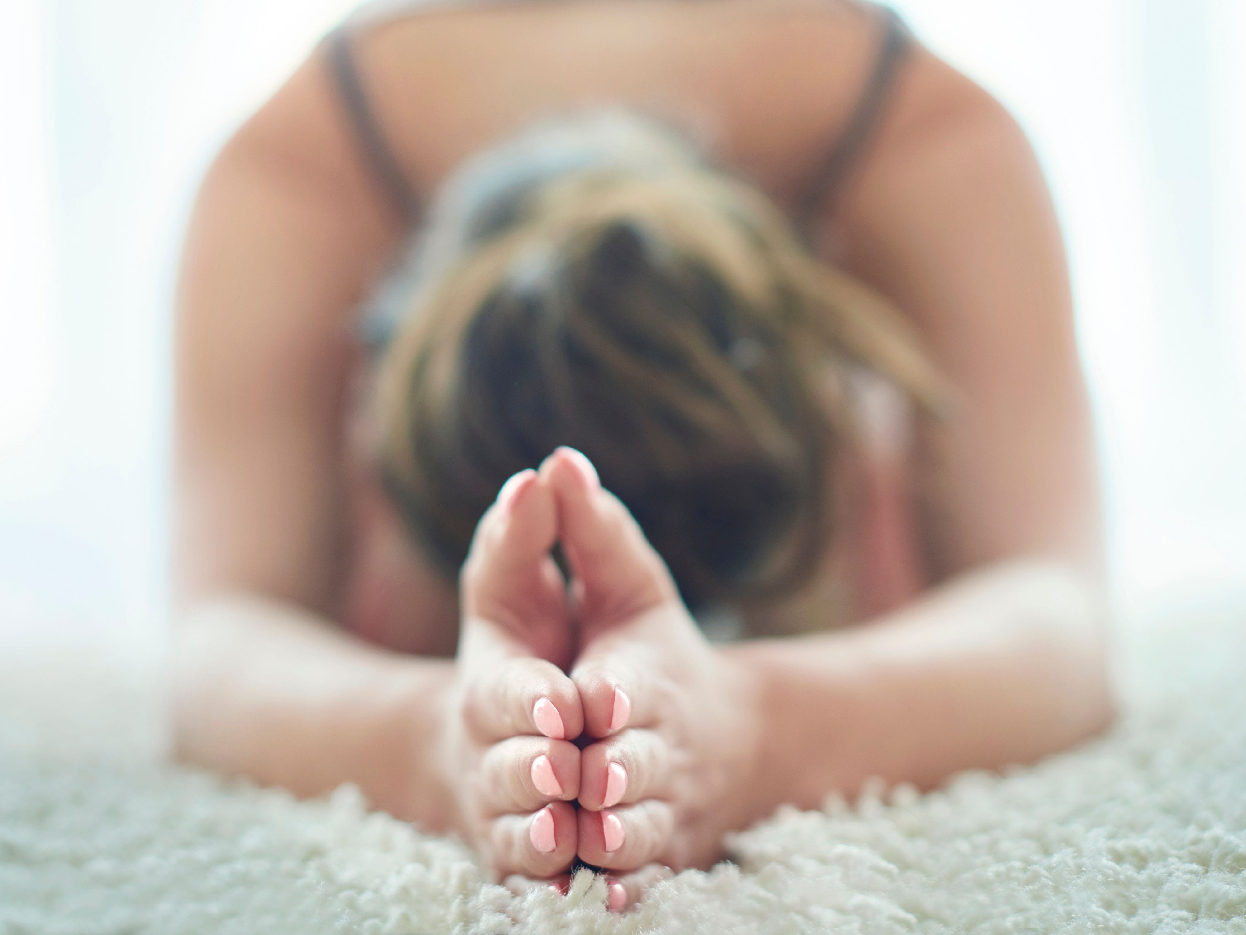 Woman in Child's Pose during yoga