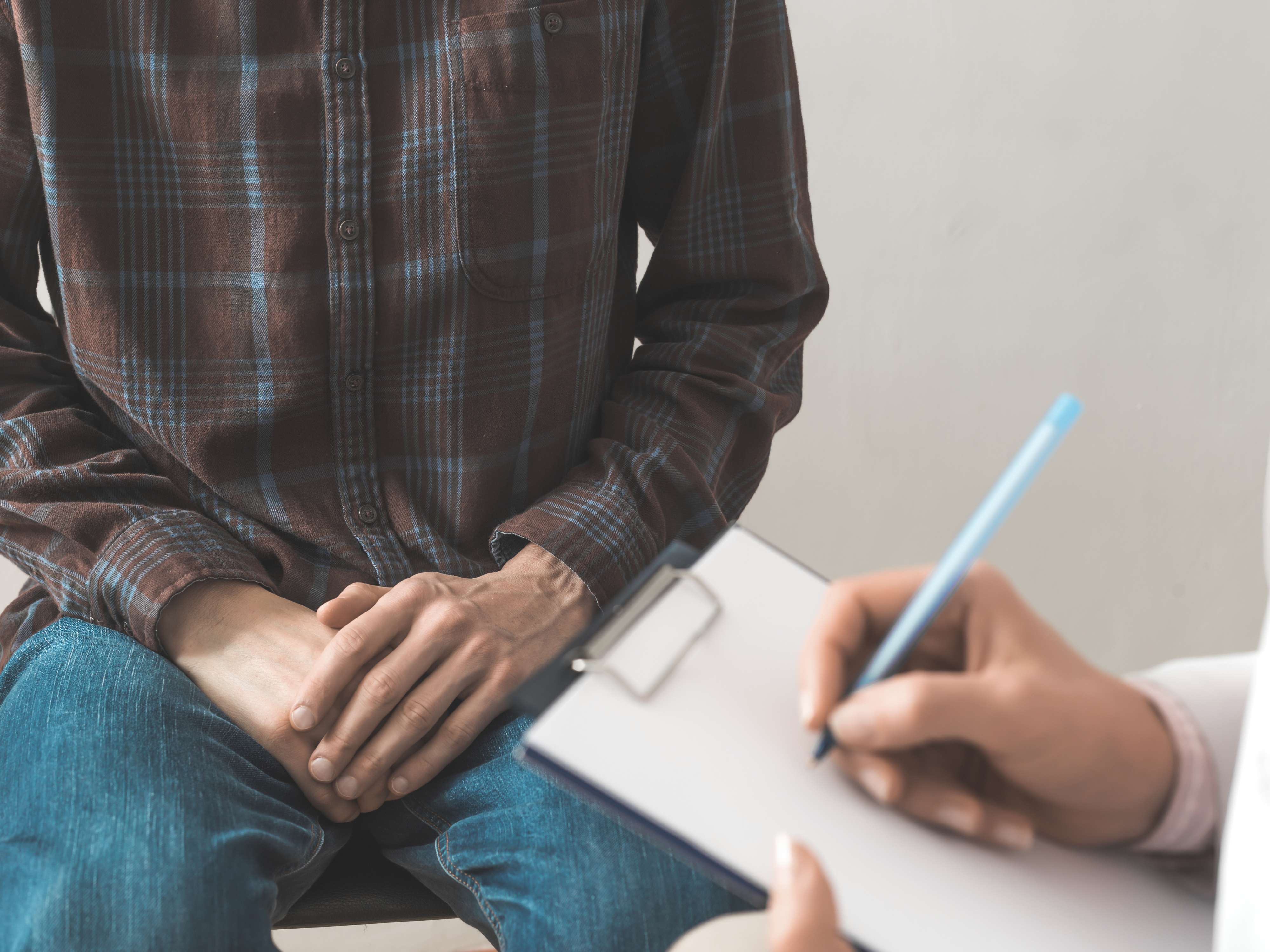 Man consulting a doctor about infertility solutions and causes of infertility in India