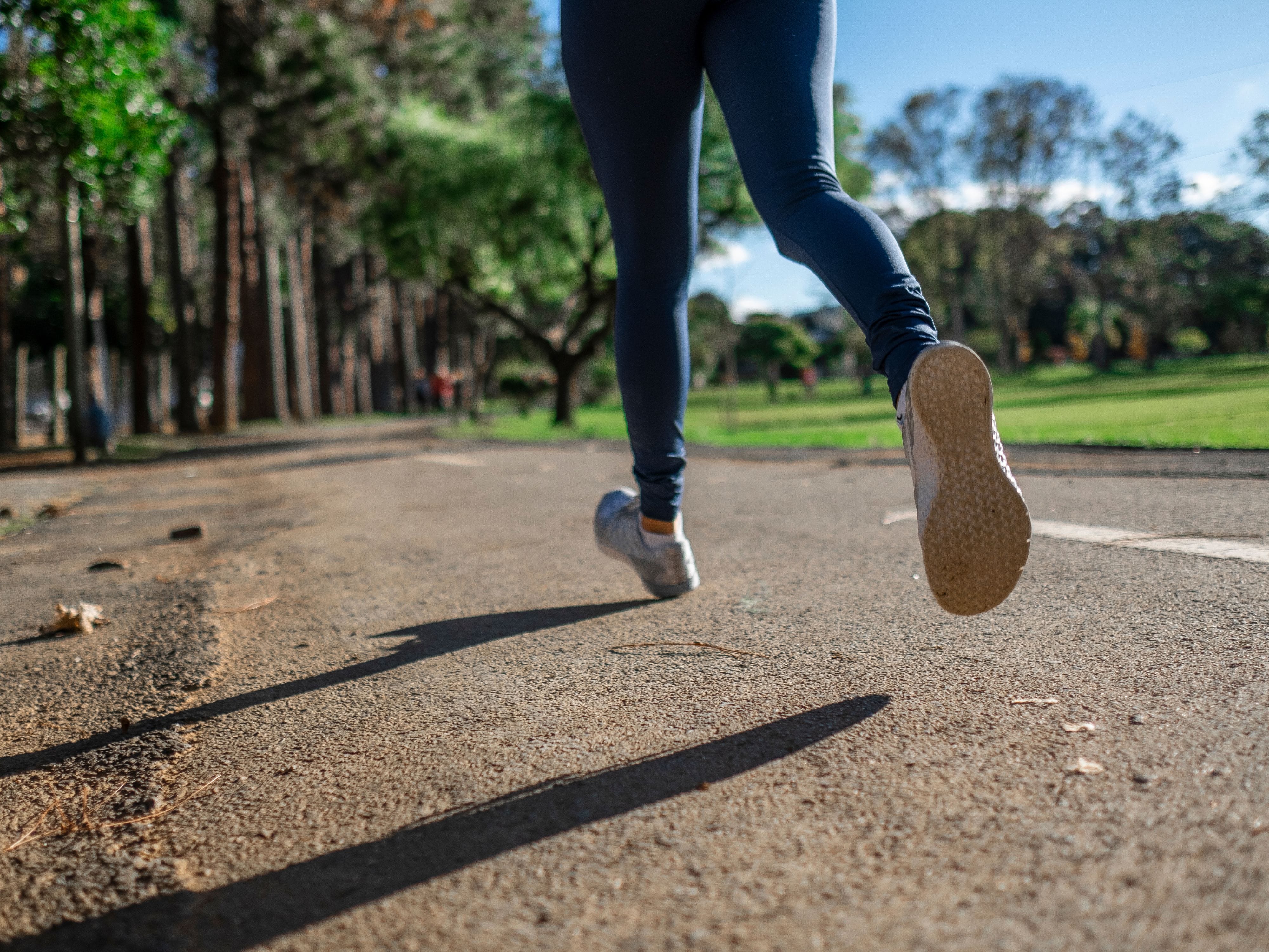Woman jogging outdoors, embracing an active and healthy lifestyle