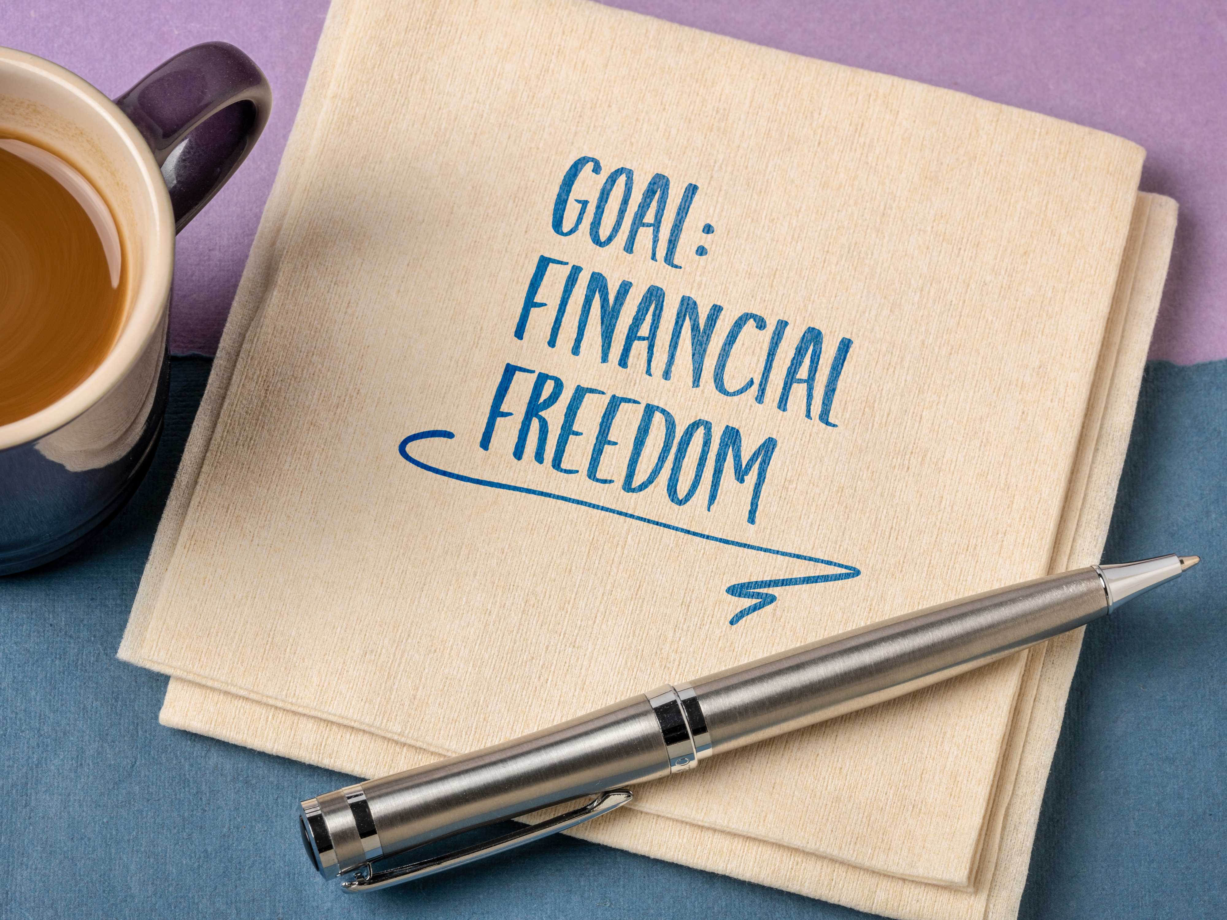 Financial Freedom' being written on paper, representing SIP investment goals