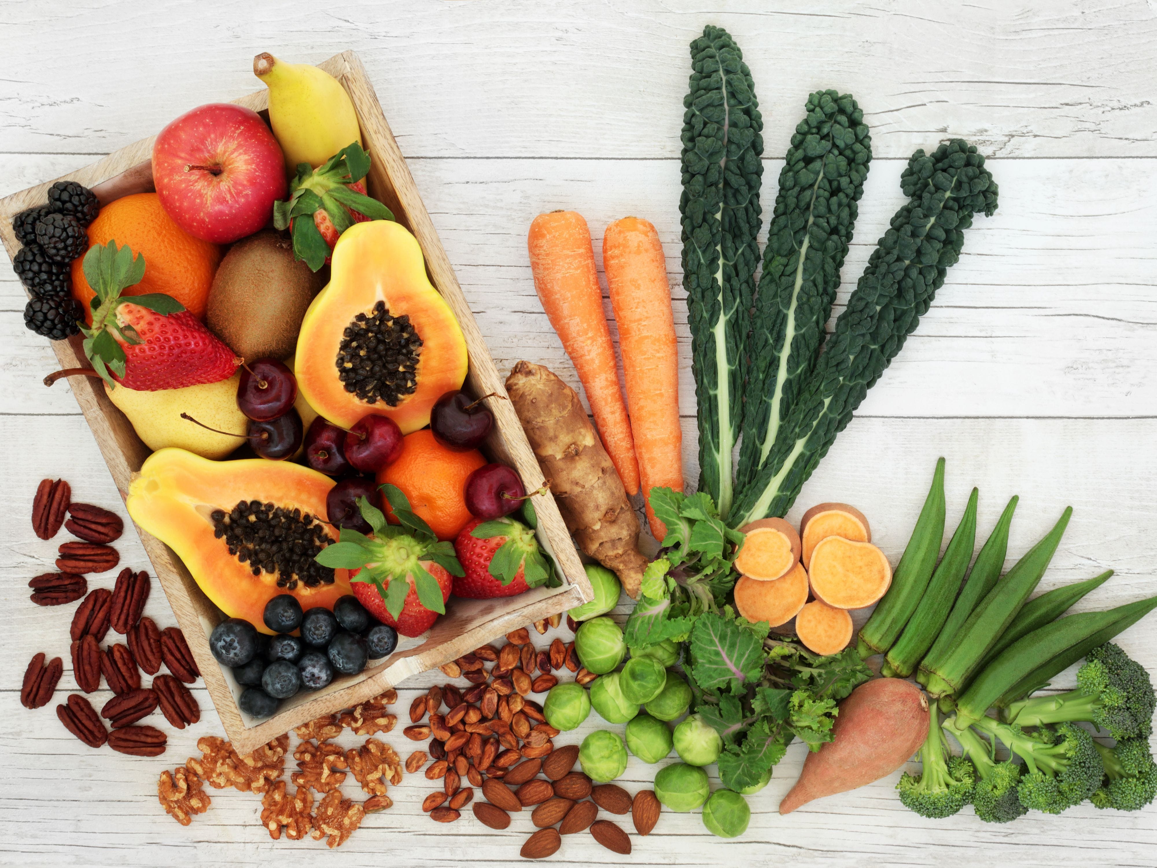 Wooden tray of high-fiber fruits and vegetables