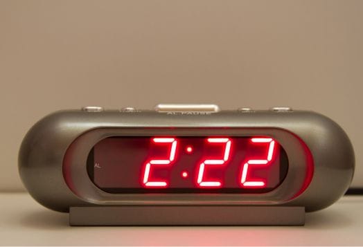 Digital alarm clock showing 2:22
