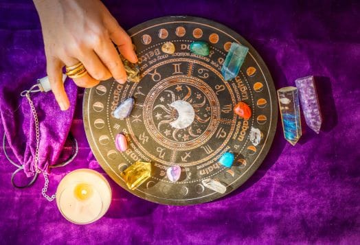 Astrology board with crystals and candle