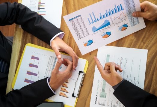 Business team analyzing financial charts