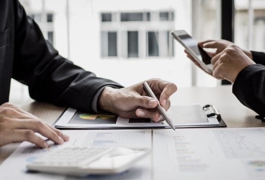 Business professionals reviewing financial data