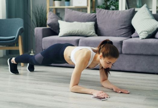 Woman doing a plank exercise at home
