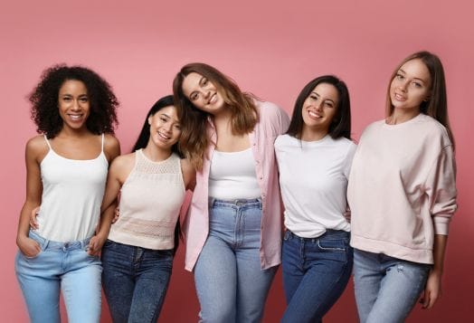 Five diverse and smiling young women