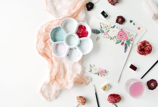 Watercolor painting setup with florals