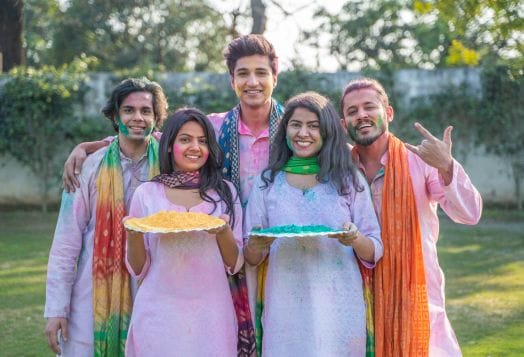 Friends covered in Holi colors