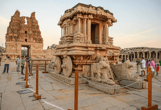 Stone chariot and ancient temple ruins in Hampi, India