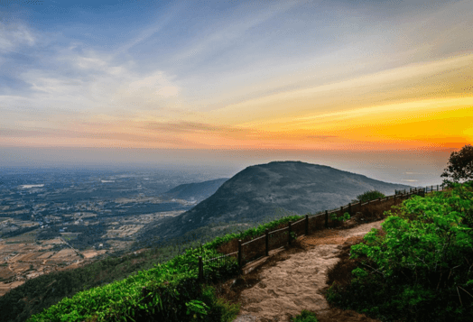 A panoramic view of Nandi Hills at sunset