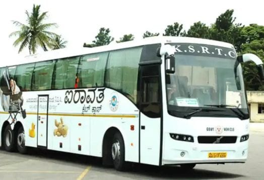 A white K.S.R.T.C. Airavata bus parked outdoors