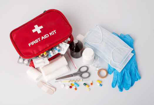 A red first aid kit with medical supplies