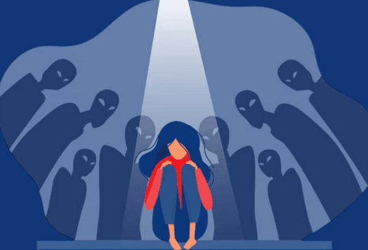 A person cowering in spotlight, surrounded by shadowy figures