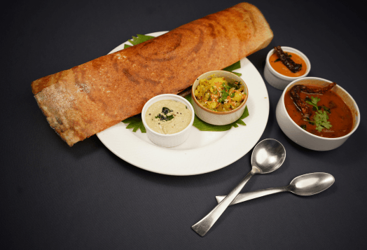 A singhara cheela roll with potato sabzi and different chutneys