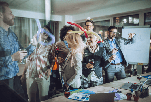 A diverse group of coworkers celebrating at a lively office party