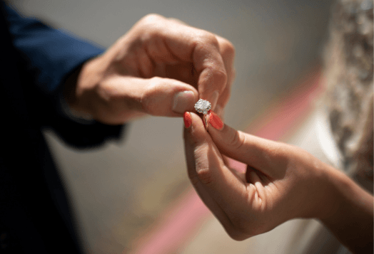 A couple exchanging an engagement ring
