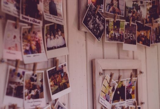 Polaroid photos hanging on a wall