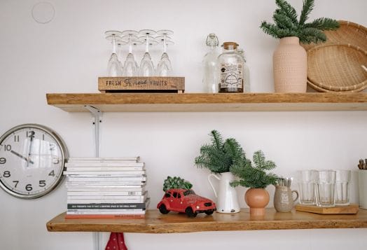 Two wooden shelves with various decorative items