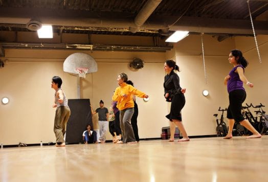 Adult dance class in a gym