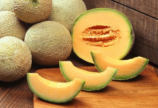 Whole and sliced honeydew melons
