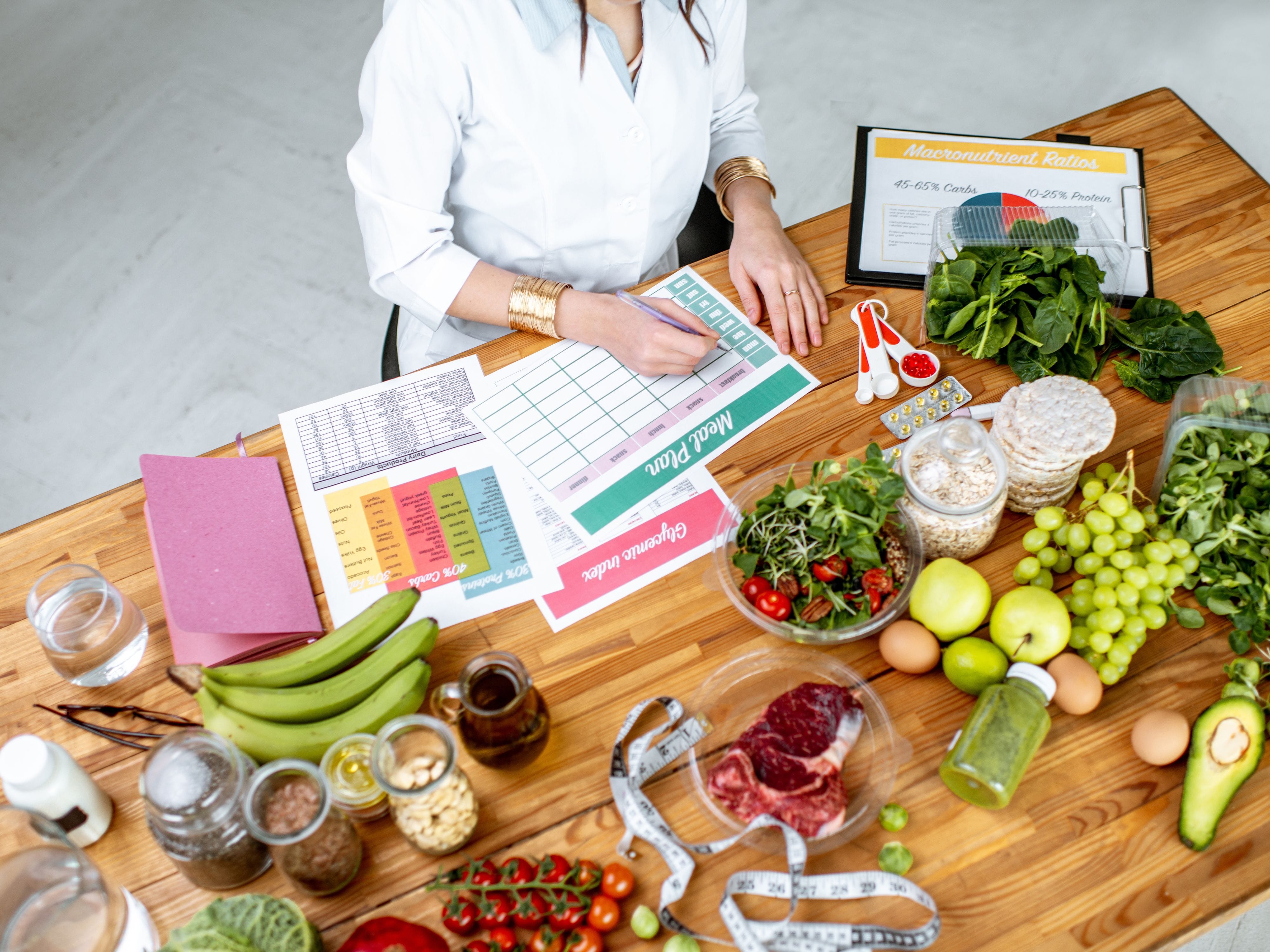 Woman planning healthy meals with fresh food