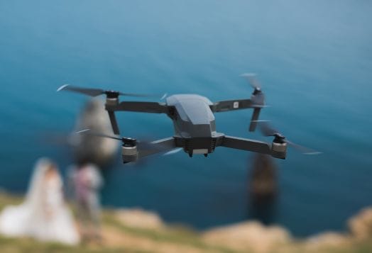 Drone flying over blurred wedding scene