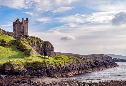 Castle on rocky shore, Scotland-like