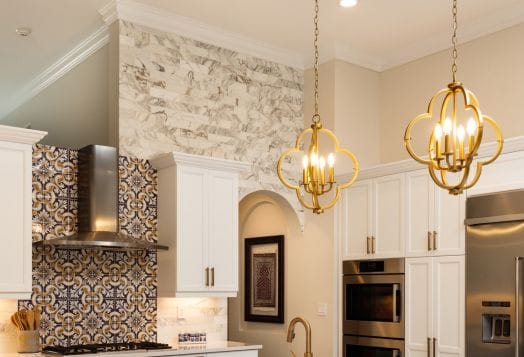 Golden chandeliers in a modern kitchen