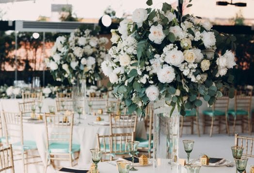 Wedding reception with white floral centerpieces
