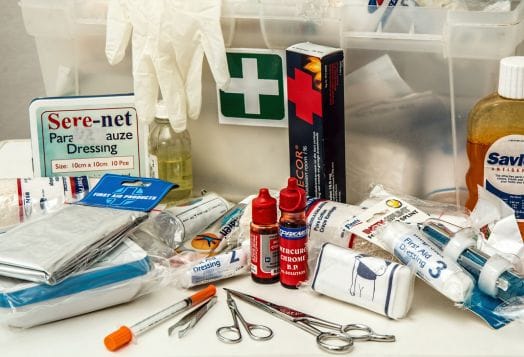 First aid kit with bandages, gloves, and tools
