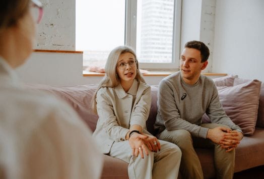Couple in couples counseling discussing relationship issues