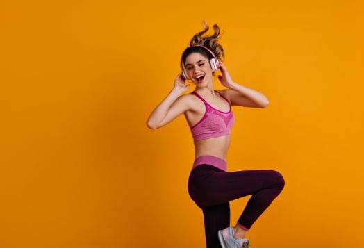 Woman dancing with headphones on
