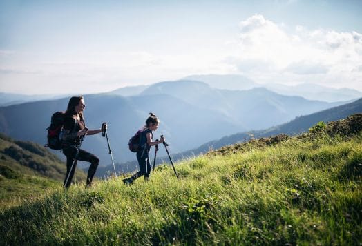 Mother and child hiking in the mountains
